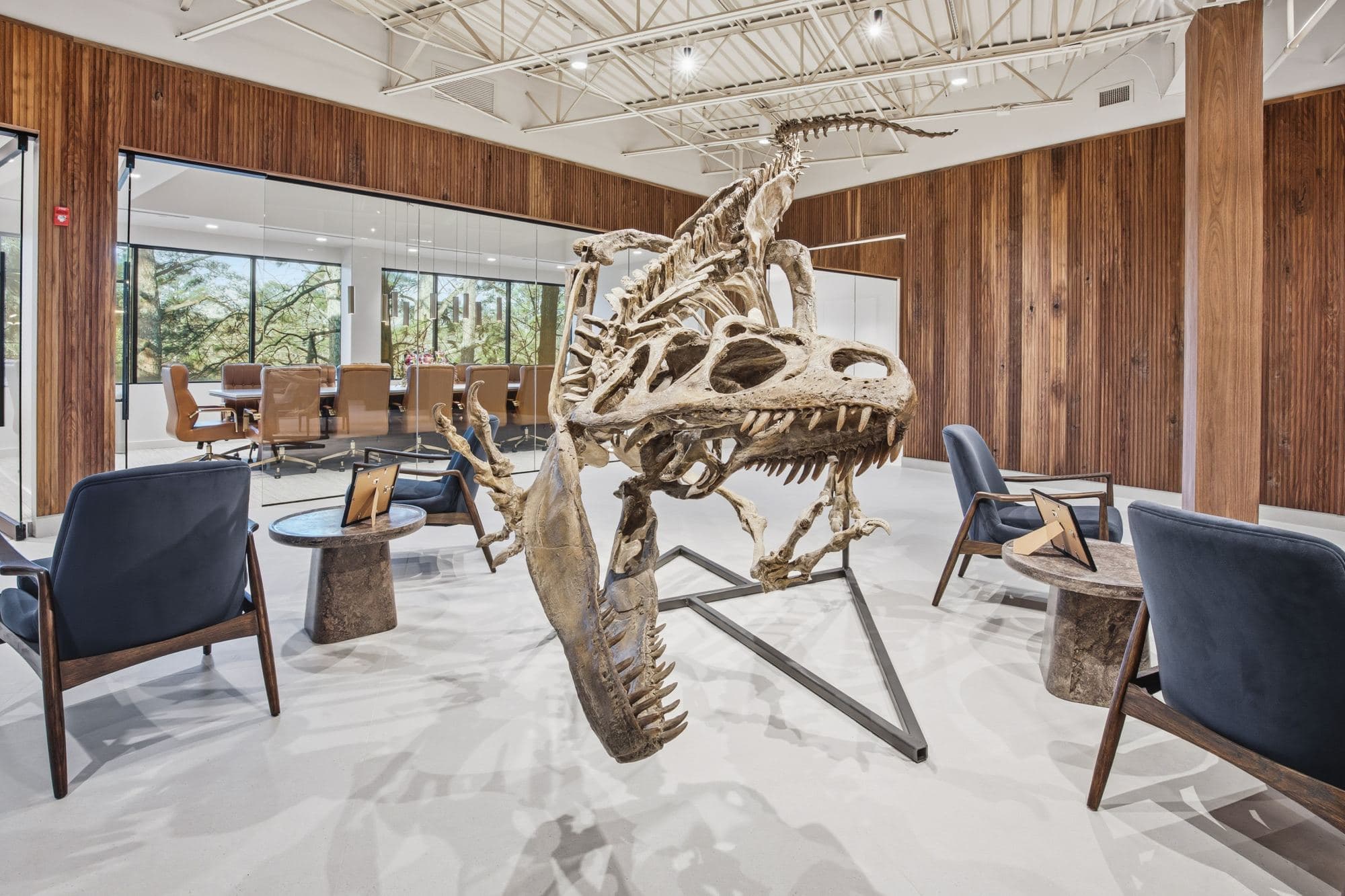 A dinosaur skeleton in the bright, wood-paneled Poole Huffman office lobby